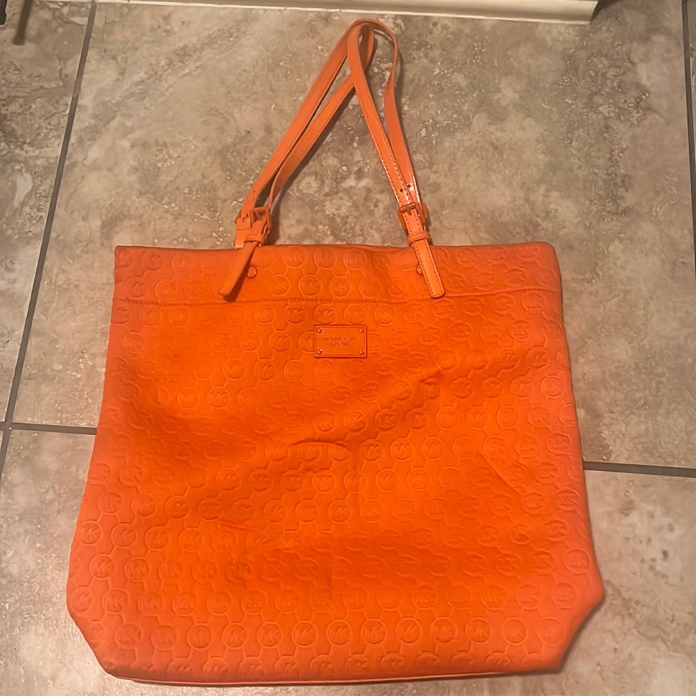 Orange Michael Kors purse.